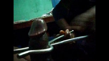 TAMIL AUNTY GRIPS A HARD COCK WITH A VESSEL HOLDER, GIVING A SLIPPERY, SENSUAL OIL MASSAGE THAT DRIPS WITH PLEASURE