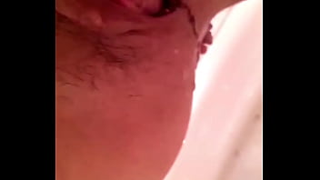 Chinese wife pissing from her urethra, peeing and wetting herself.