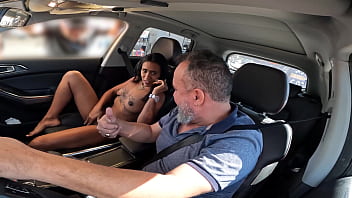 A sultry Carioca MILF, India Juju, the queen of gangbangs, strips naked in her car and teases the crowd with her wild desires.