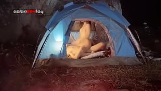 Passionate Asian lovers sneak steamy tent sex while their friends sleep nearby